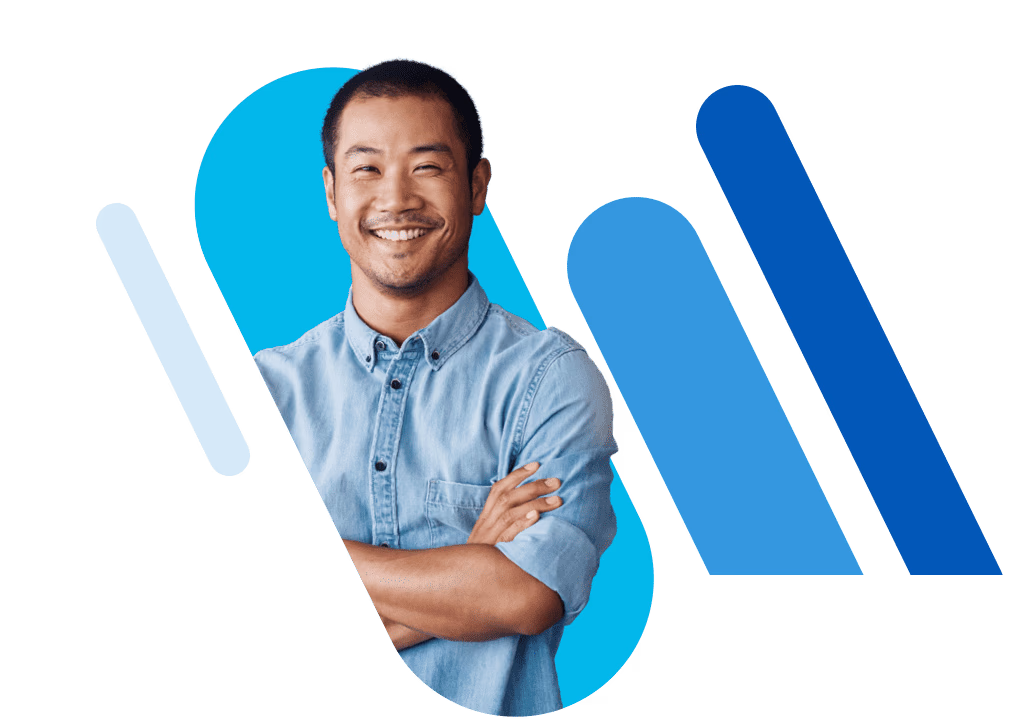 Man with arms crossed standing in front of blue bars.