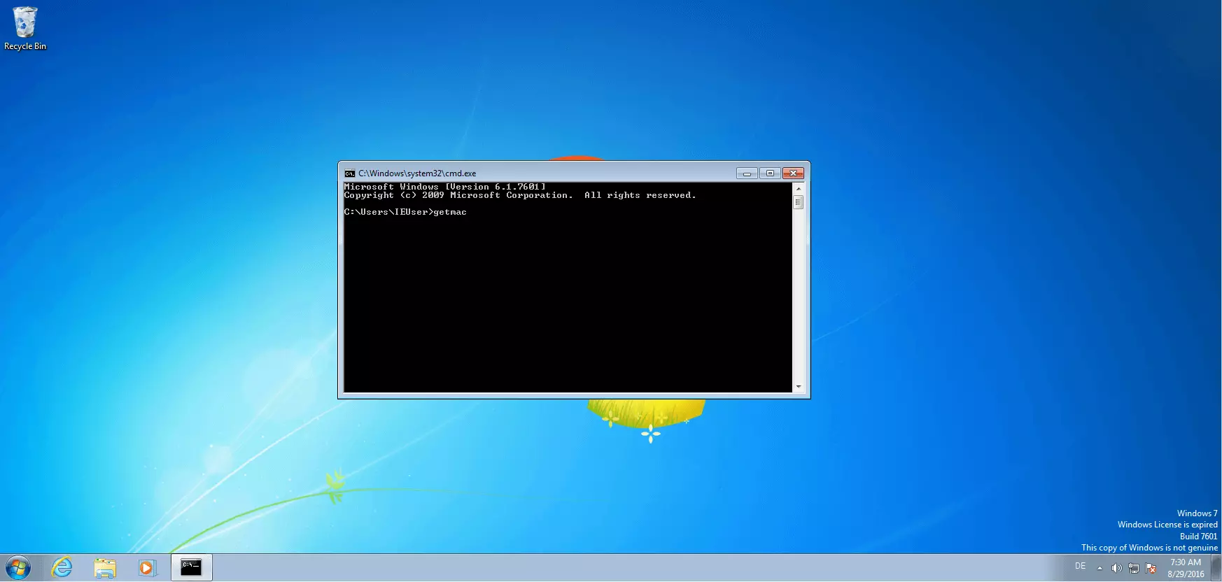 The command “getmac” in the Windows command prompt